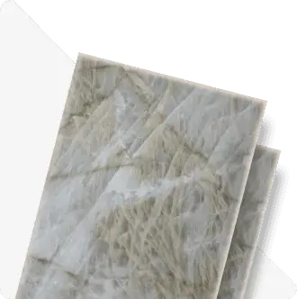 Quartzite slab swatch with soft grey background and golden linear veining, cut corner showing stone edge detail