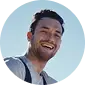 Portrait of a bearded man smiling, circular profile photo
